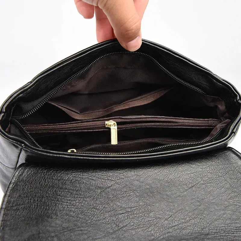 Intérieur sac bandoulière femme cuir noir motif feuille