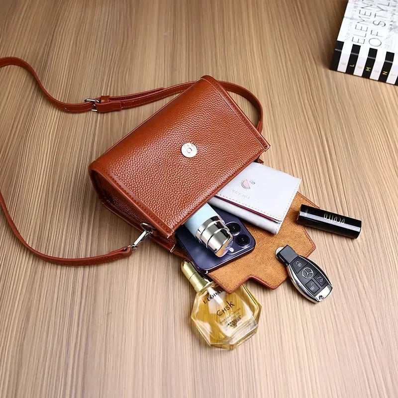Petit sac à main bandoulière femme rempli