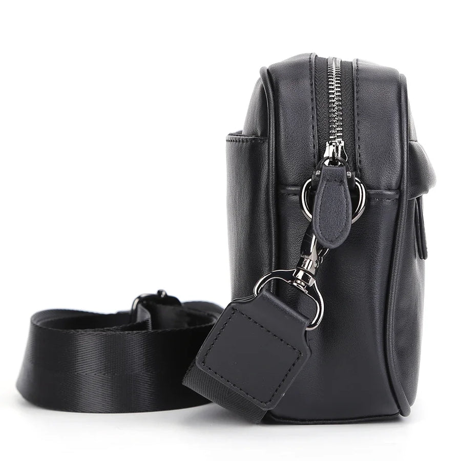 Petit sac bandoulière en cuir discret noir côté