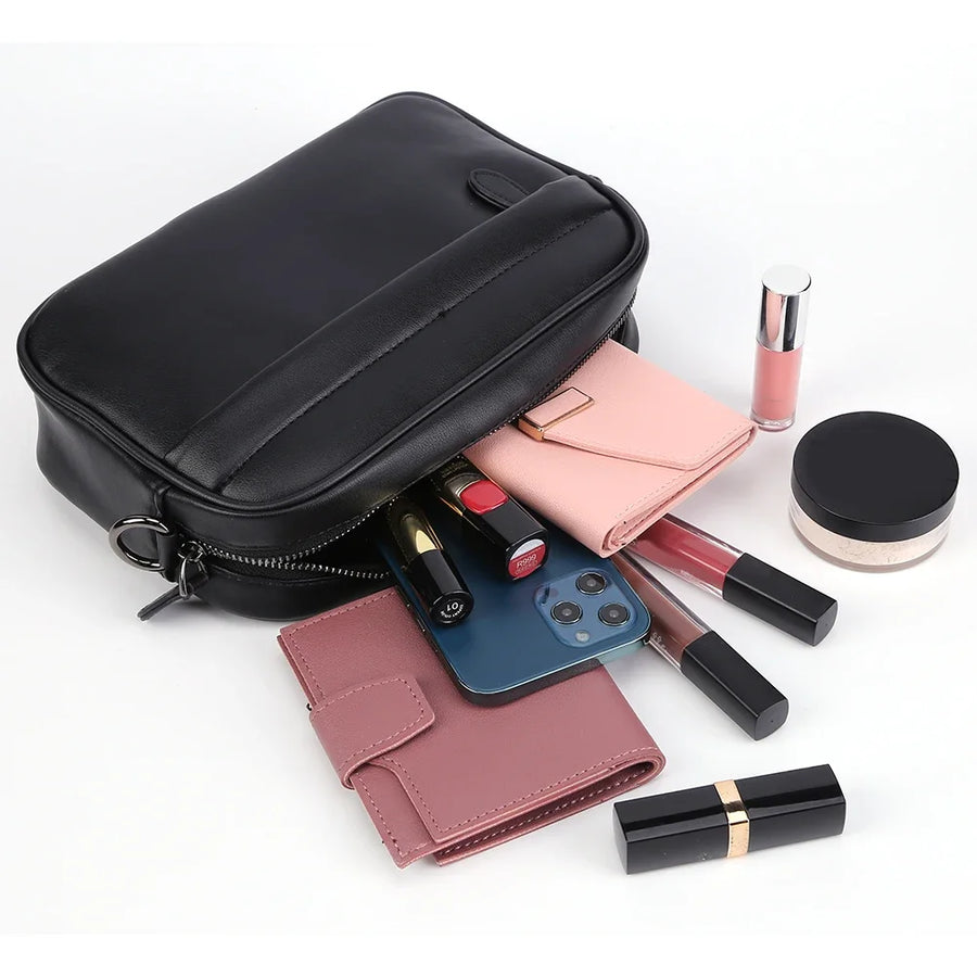 Petit sac bandoulière en cuir discret noir plein