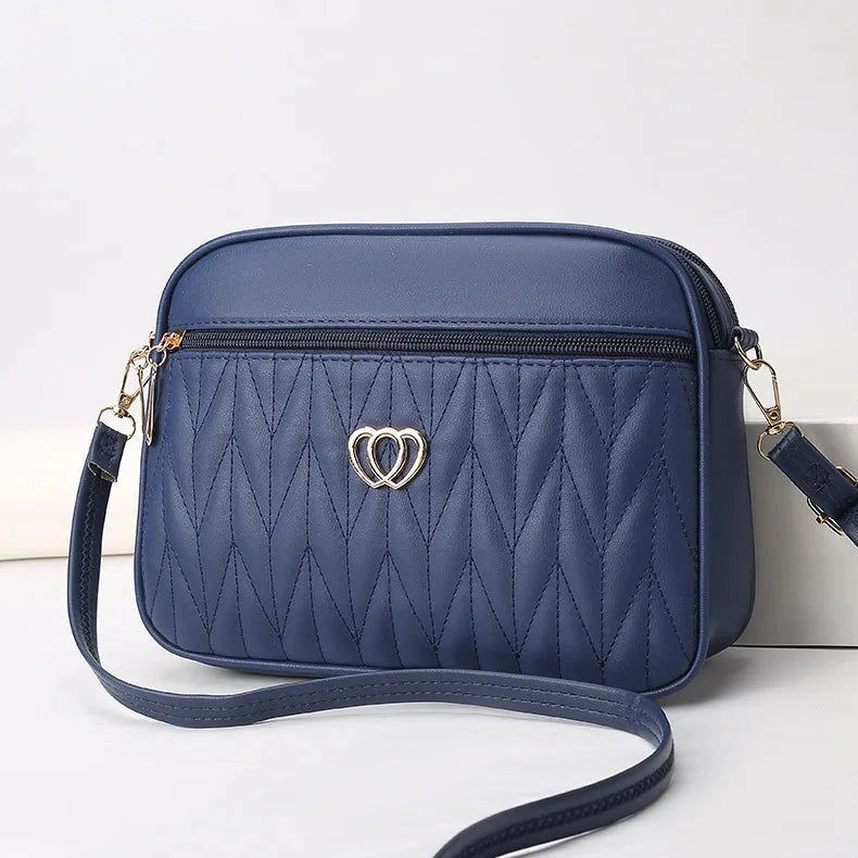 Sac bandoulière compact en cuir synthétique bleu pour femme