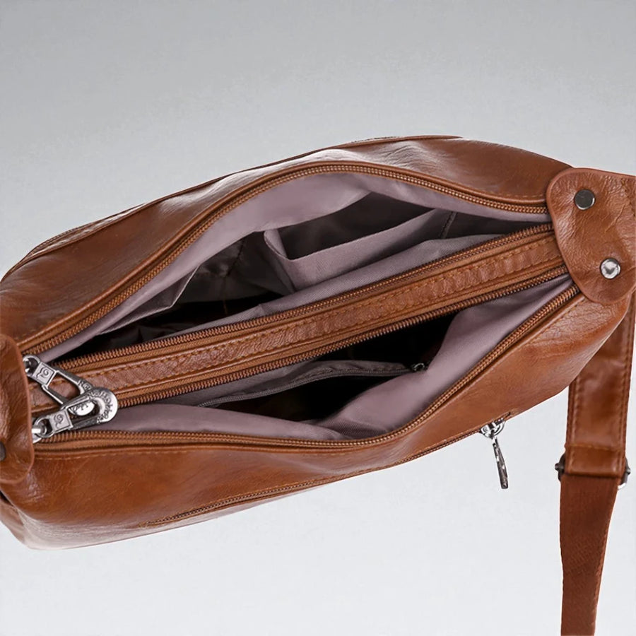 Sac bandoulière en cuir pour femme intérieur