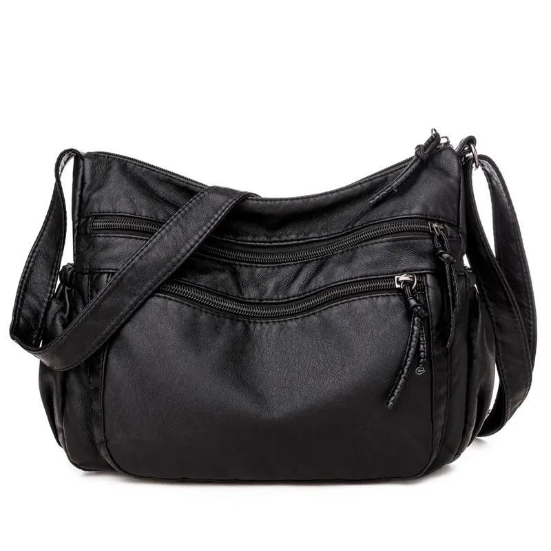 Sac bandoulière femme en cuir noir grandes poches