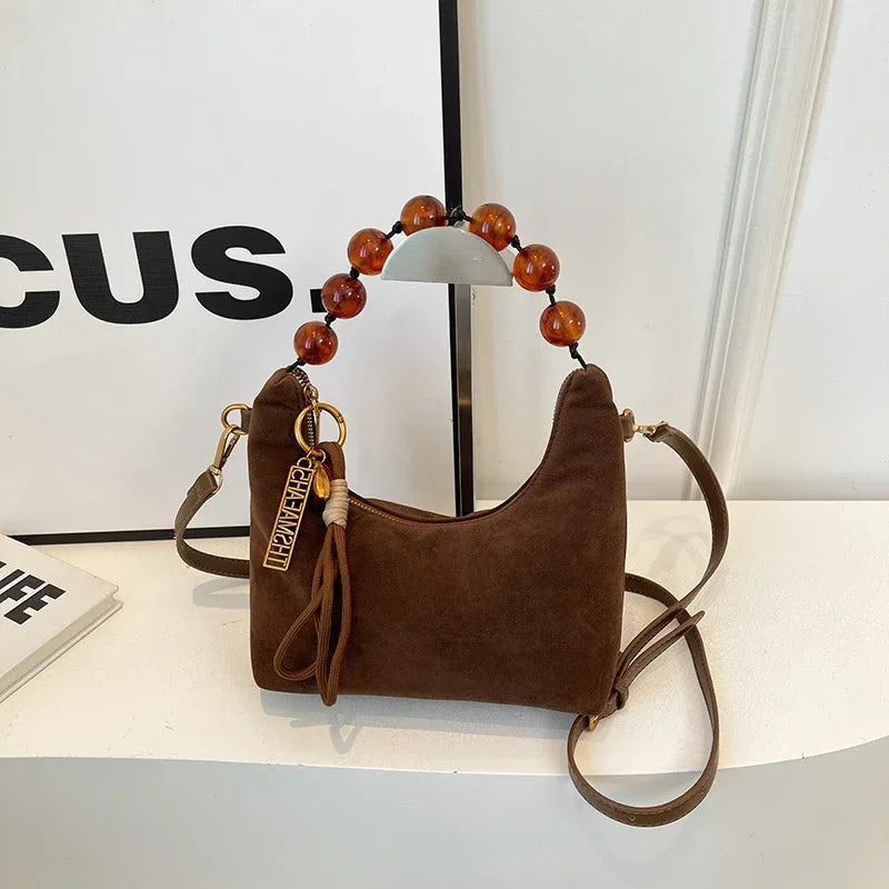 Sac bandoulière grosses perles couleur marron