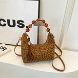 Sac bandoulière grosses perles motif léopard