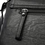 Sac besace en cuir pour femme noir détails zip