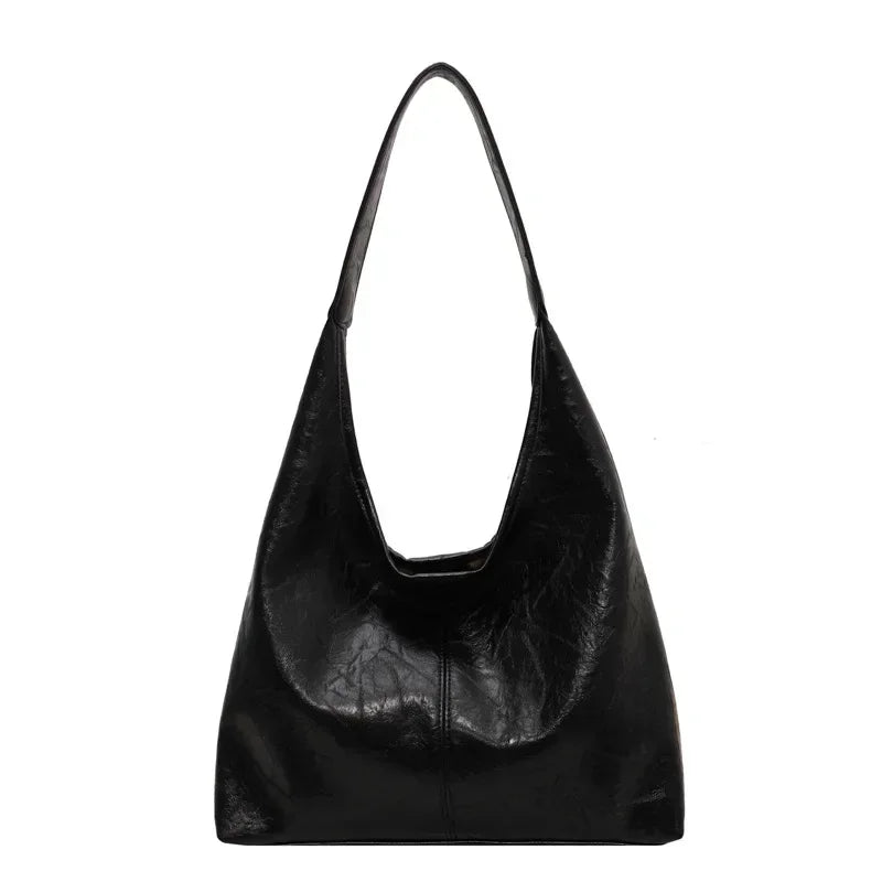 Le sac fourre-tout à bandoulière Sak Olvera Benin Le sac fourre-tout à bandoulière Sak Olvera Benin