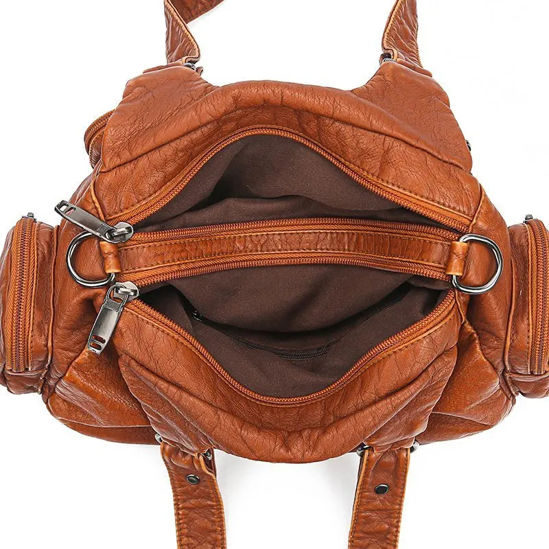Sac à main multi-poches en cuir marron avec bandoulière intérieur