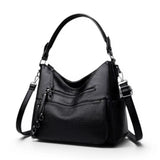 Grand sac à main bandoulière en simili cuir noir, vue de trois quarts