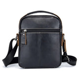Sacoche Le Sac Bandoulière en cuir véritable noir, compacte avec bandoulière réglable et poches zippées pratiques.