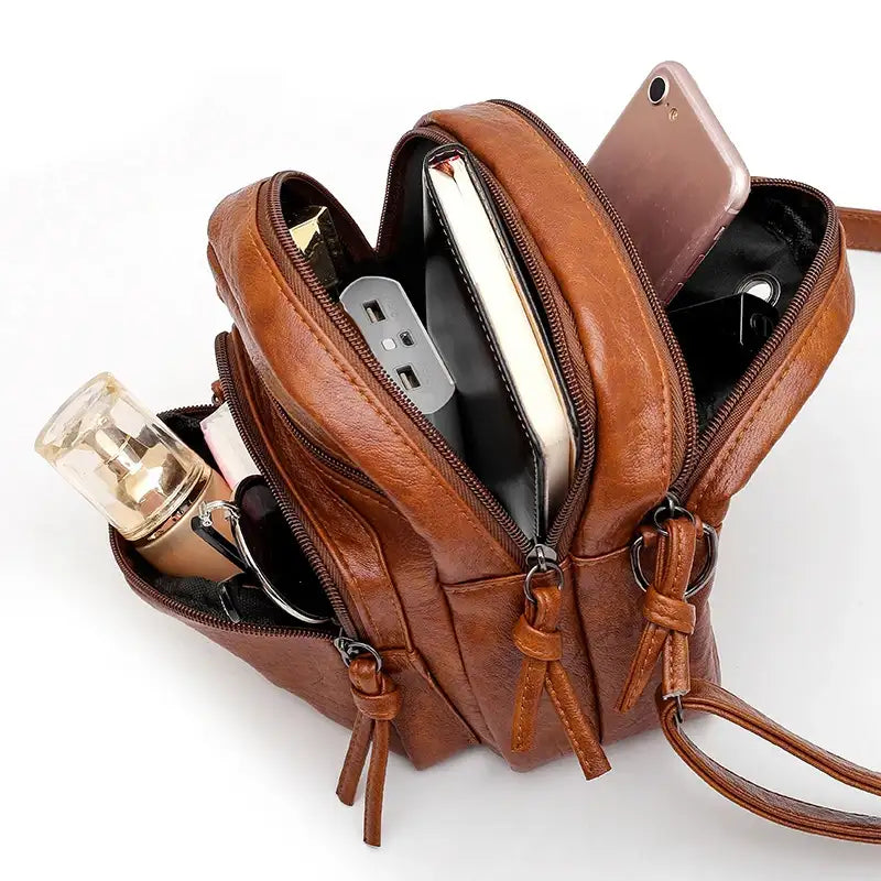 Petite sacoche bandoulière femme interieur rempli