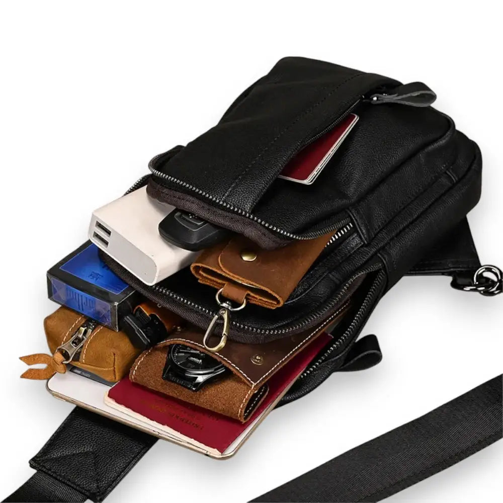Sac à dos bandoulière en cuir noir rempli