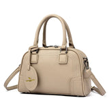 Sac à main poignées et bandoulière marron clair de trois quarts