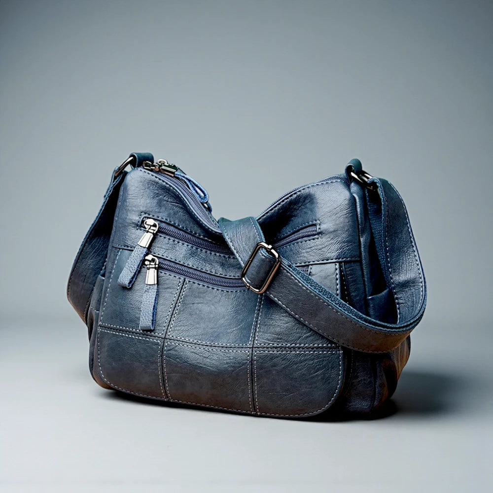 Sac bandoulière bleu femme avec surpiqûres de trois quarts