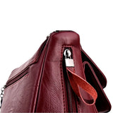 Sac bandoulière en cuir souple pour femme bordeaux intérieur poche latérale
