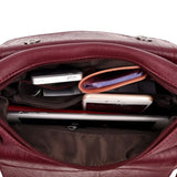 Sac bandoulière en cuir souple pour femme bordeaux rempli