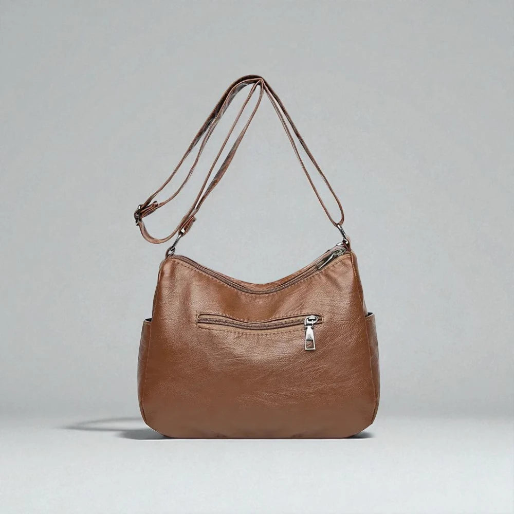 Sac bandoulière cuir souple multiples poches de dos