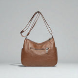 Sac bandoulière cuir souple multiples poches de dos