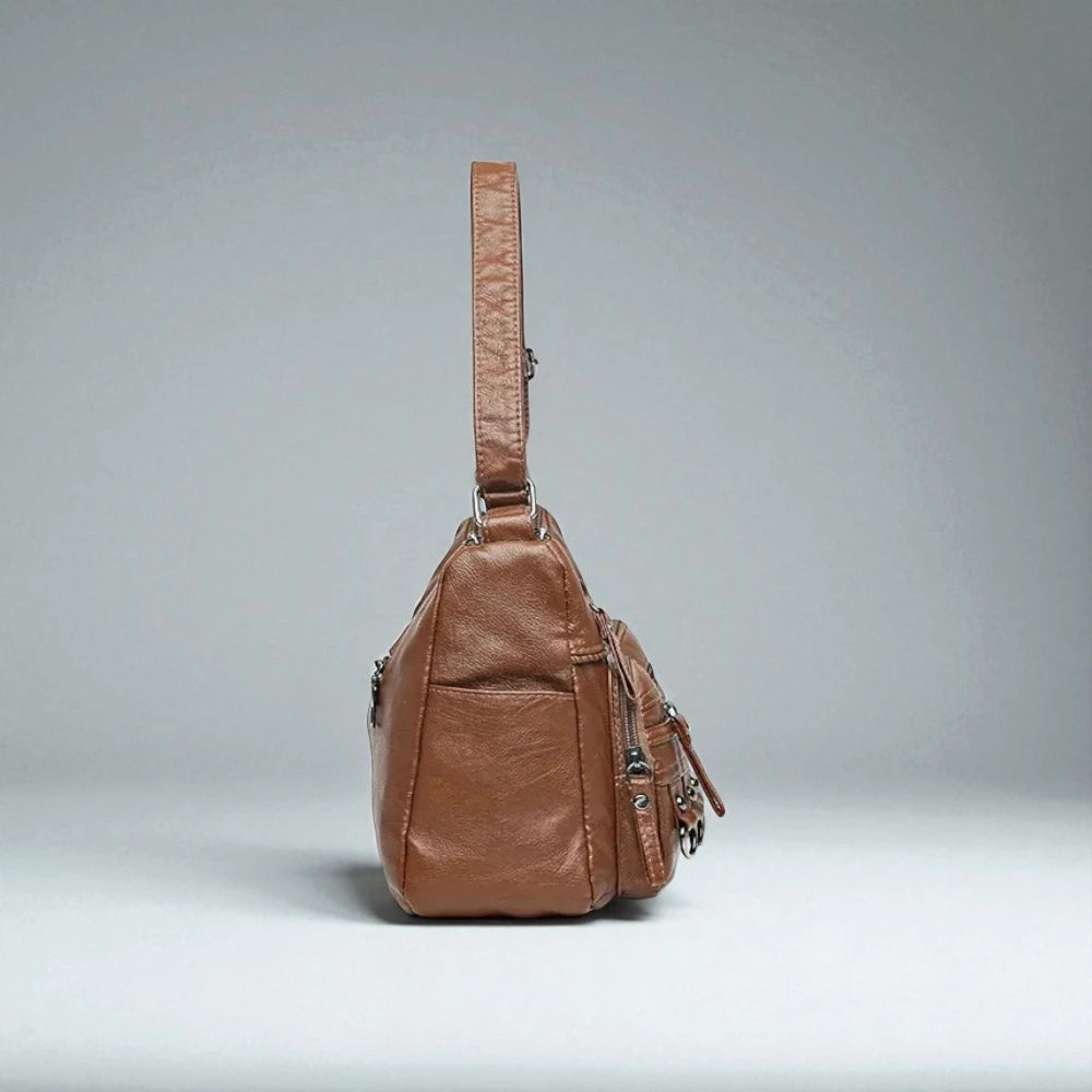 Sac bandoulière cuir souple multiples poches de côté