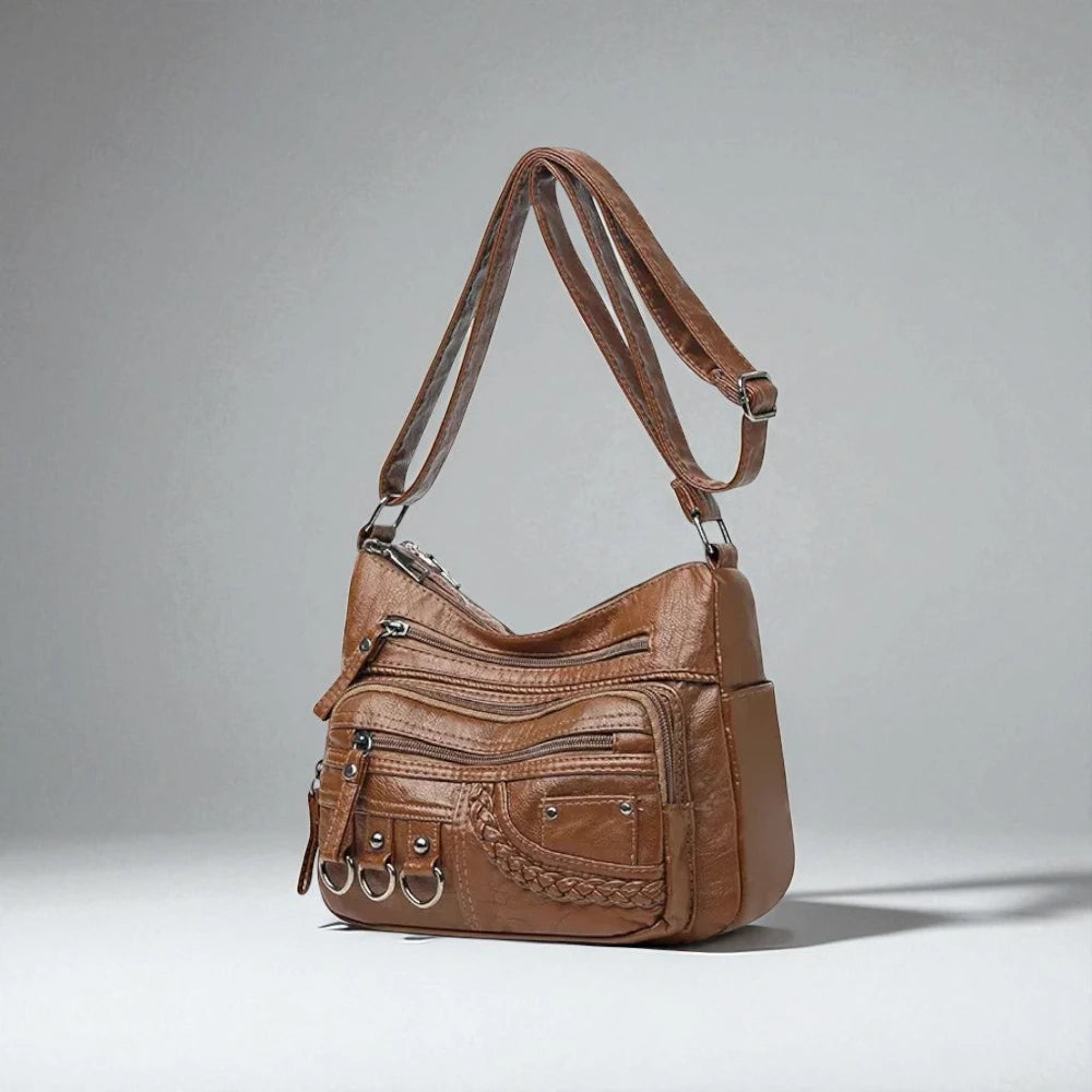 Sac bandoulière cuir souple multiples poches marron de trois quarts