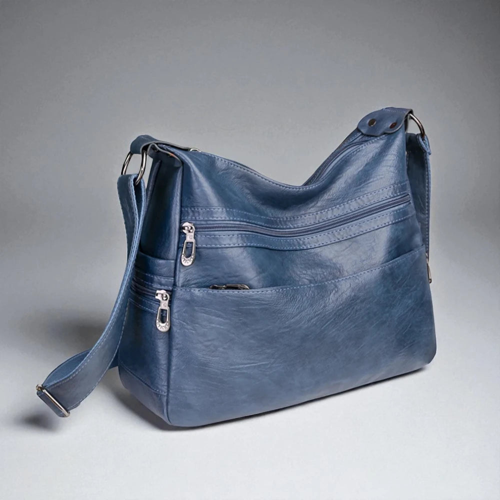 Sac bandoulière en cuir pour femme bleu photo