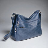 Sac bandoulière en cuir pour femme bleu photo