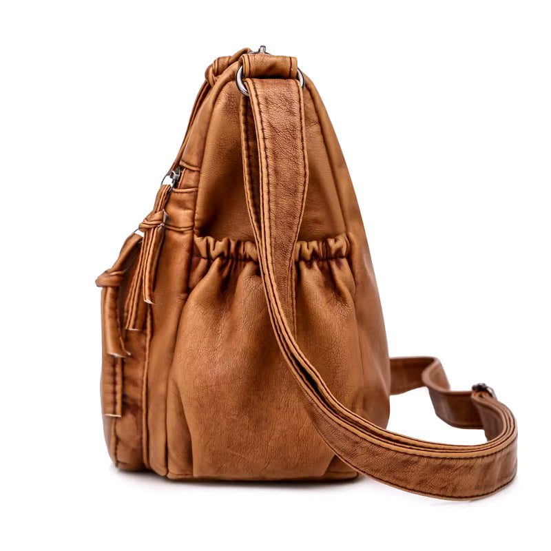 Sac bandoulière femme en cuir camel grandes poches, vue de côté