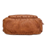 Sac bandoulière femme en cuir camel grandes poches, vue de dessous