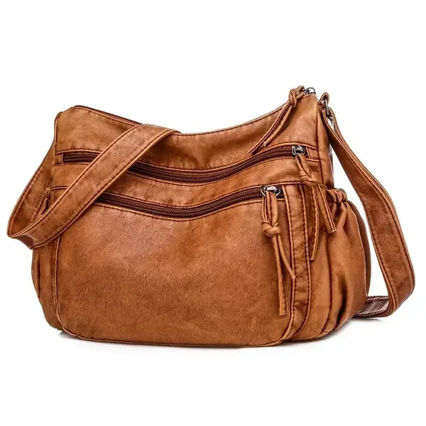 Sac bandoulière femme en cuir camel grandes poches de trois quarts