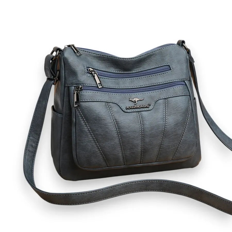 Sac bandoulière femme en cuir souple bleu de trois quarts