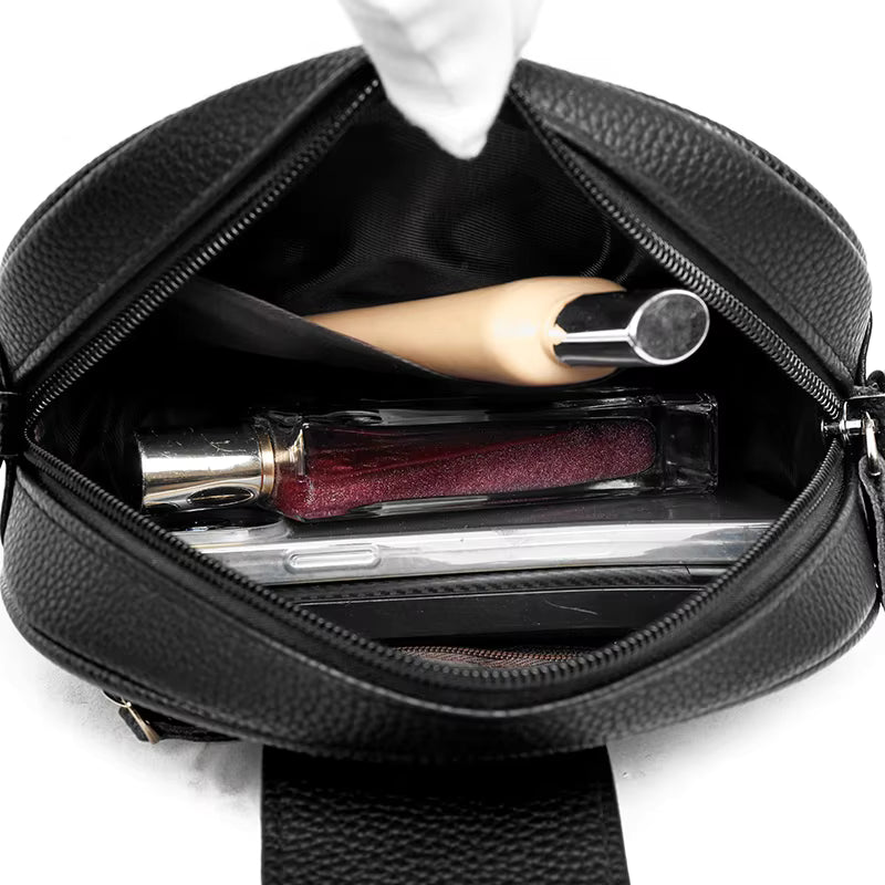Sac bandoulière femme en cuir véritable, intérieur rempli d'affaires