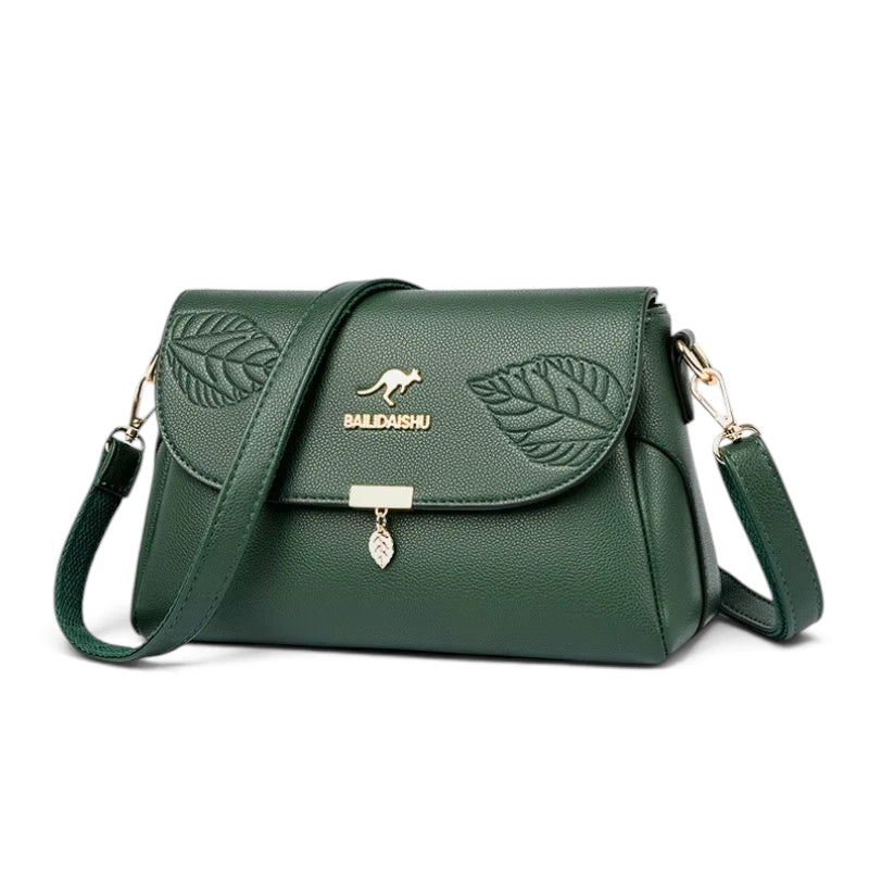 Sac bandoulière femme cuir vert motif feuille, vue de trois quarts