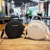 Sac bandoulière rond, variantes noir et blanc