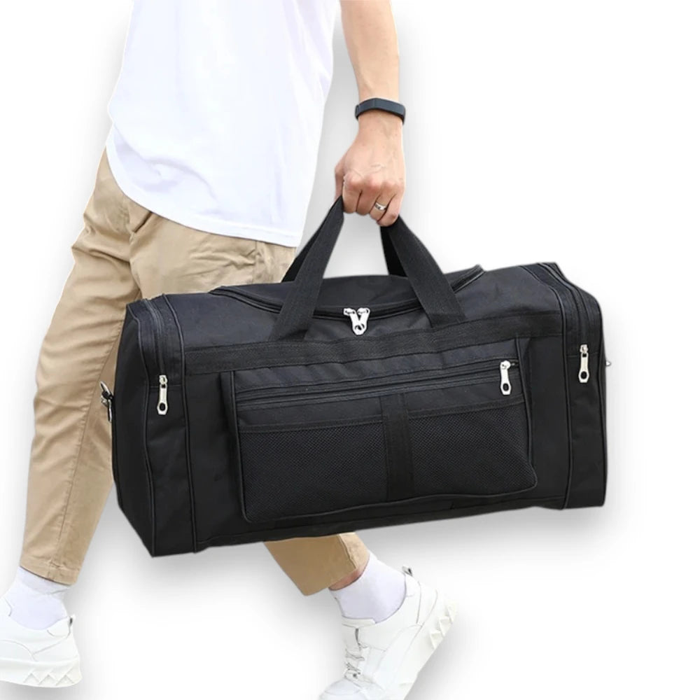 Sac de voyage sport & week-end noir porté à la main