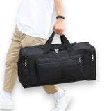 Sac de voyage sport & week-end noir porté à la main