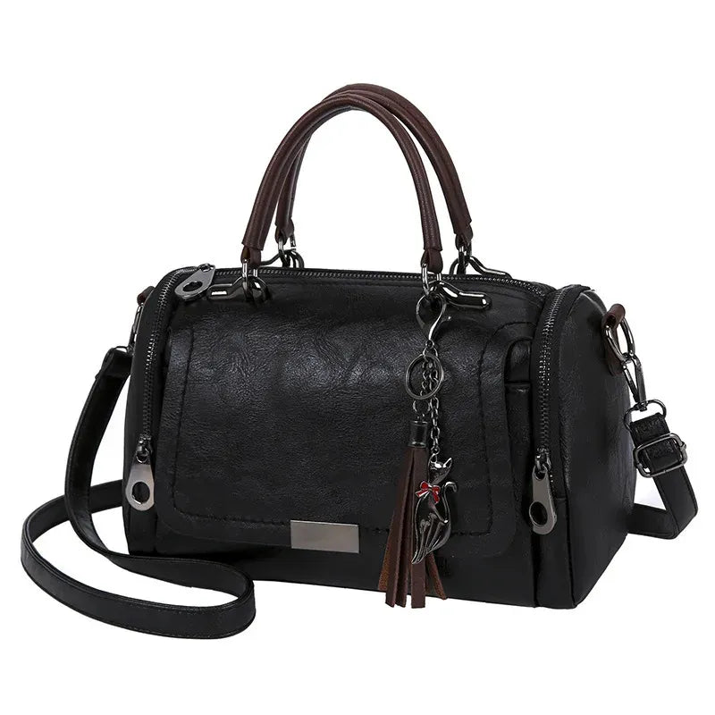 Yves Saint Laurent YSL - Sac bandoulière à pompons en cuir marron Yves Saint Laurent YSL - Sac bandoulière à pompons en cuir marron