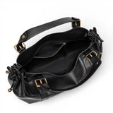 Sac à main vintage noir vu du dessus, ouverture et anses
